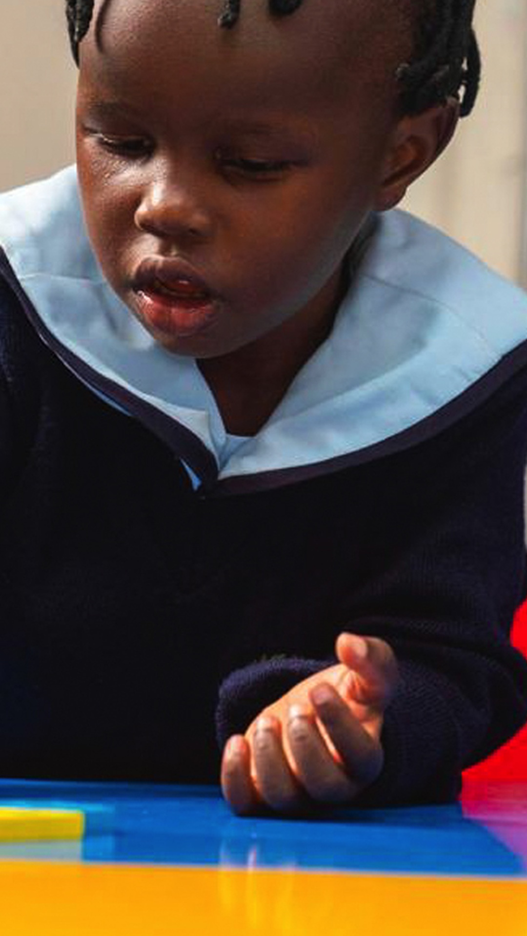 A child playing in the school’s website photograph